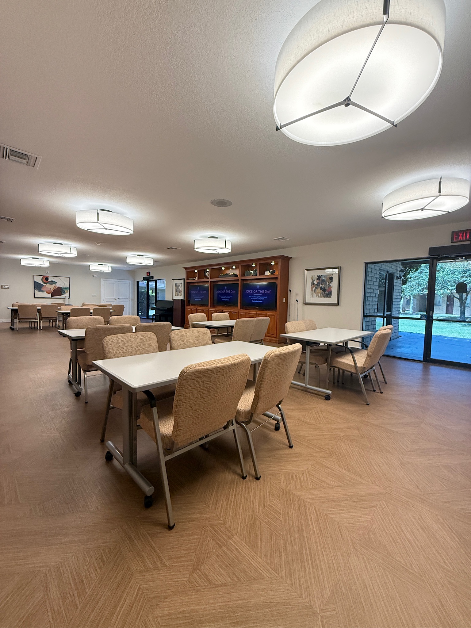 Bright common area with tables and chairs