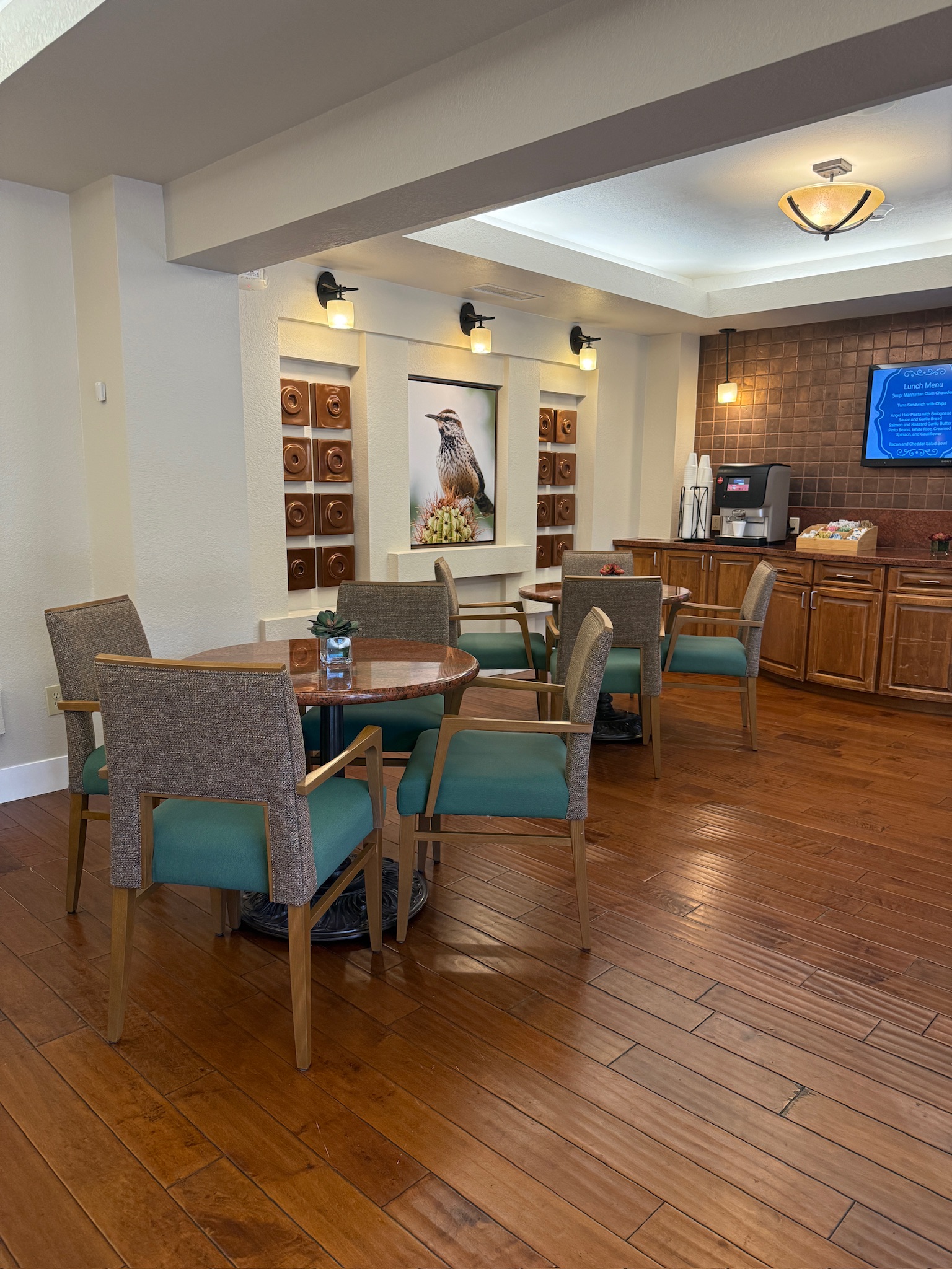Common area with seating and décor in a senior living facility