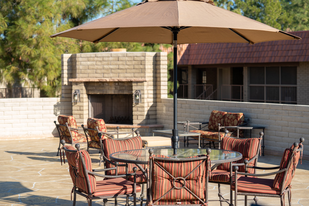 Outdoor seating area with a fireplace