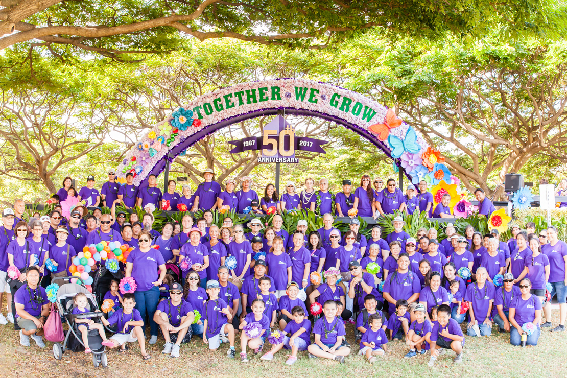 Residents and staff celebrating the 50th anniversary outdoors