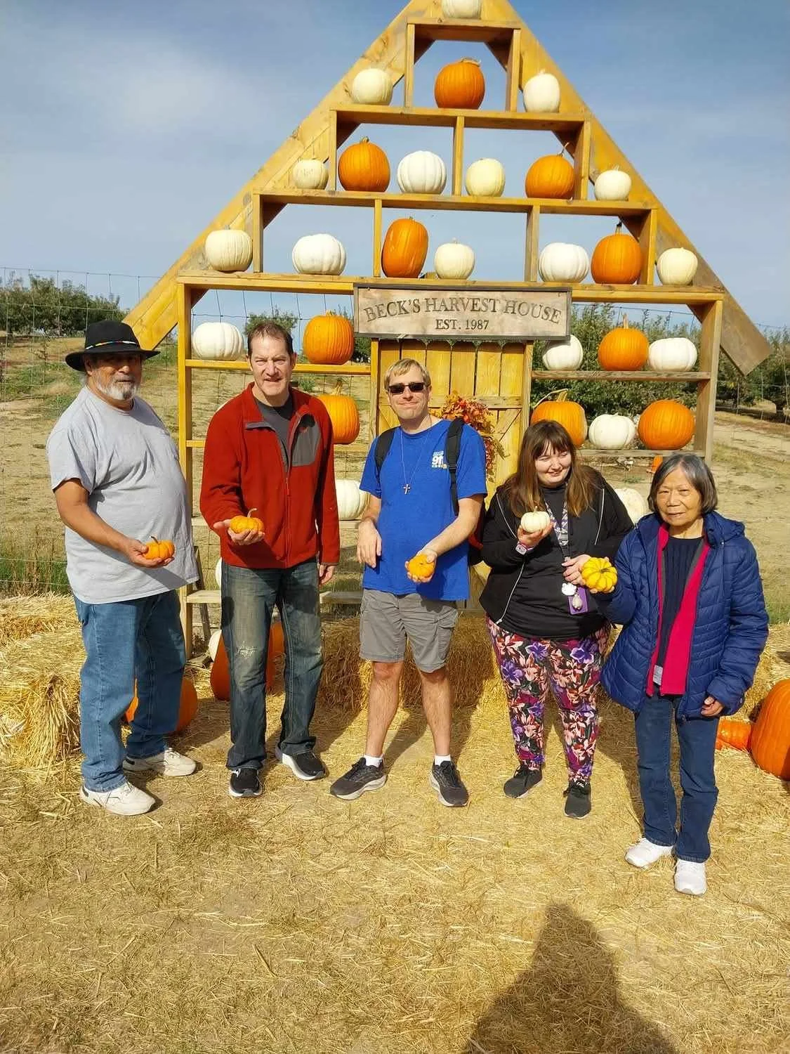 Residents enjoying pumpkins at a harvest event