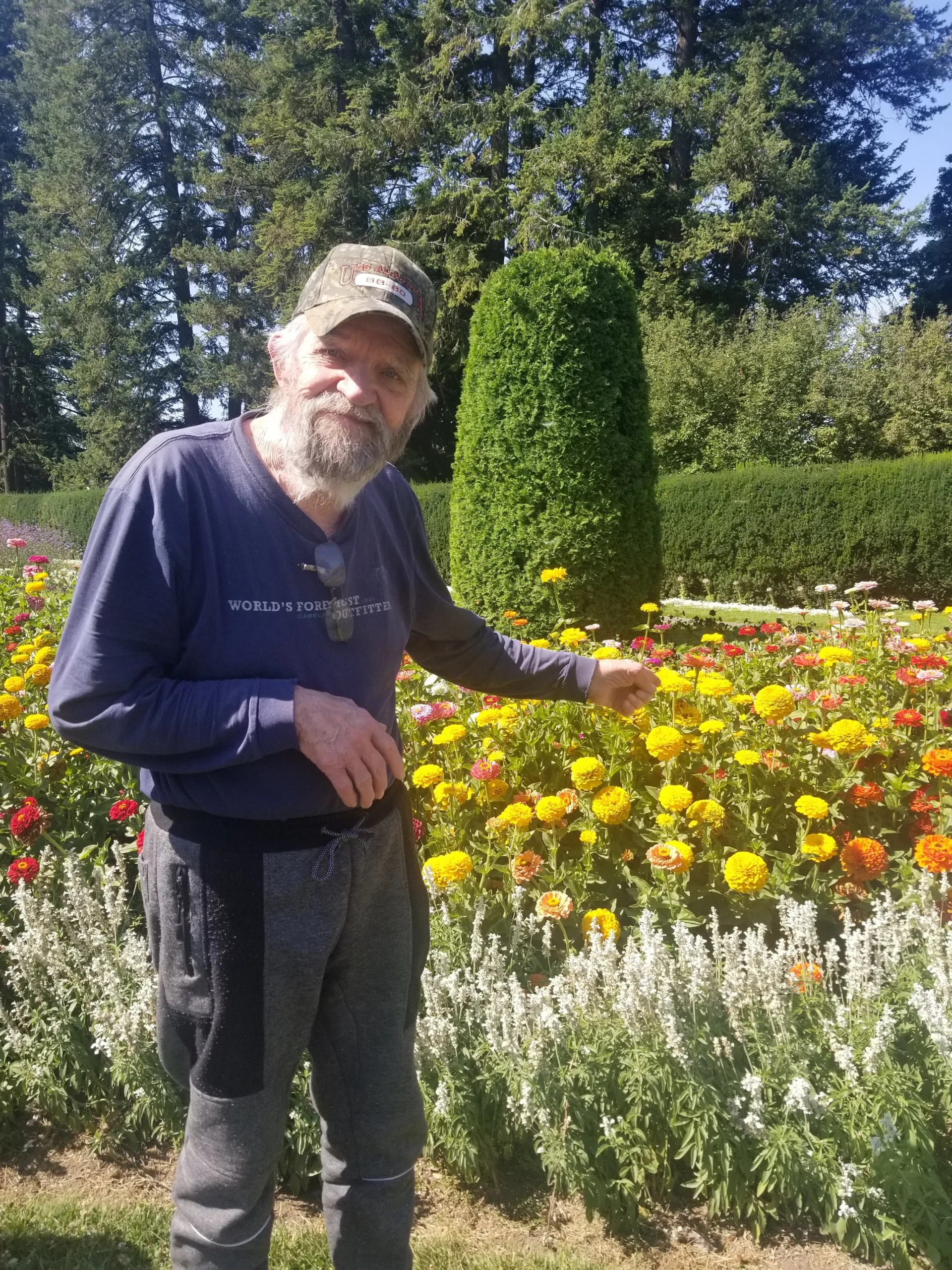 Resident enjoying a vibrant flower garden.