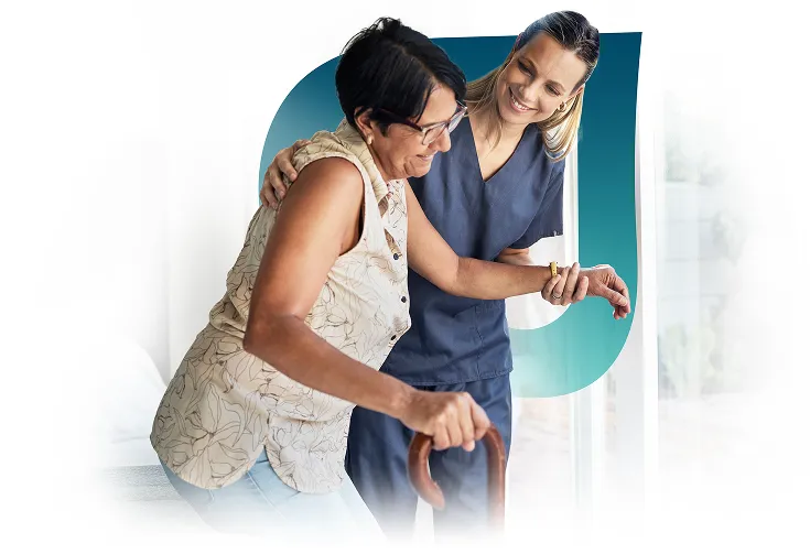 Healthcare staff assisting a resident indoors
