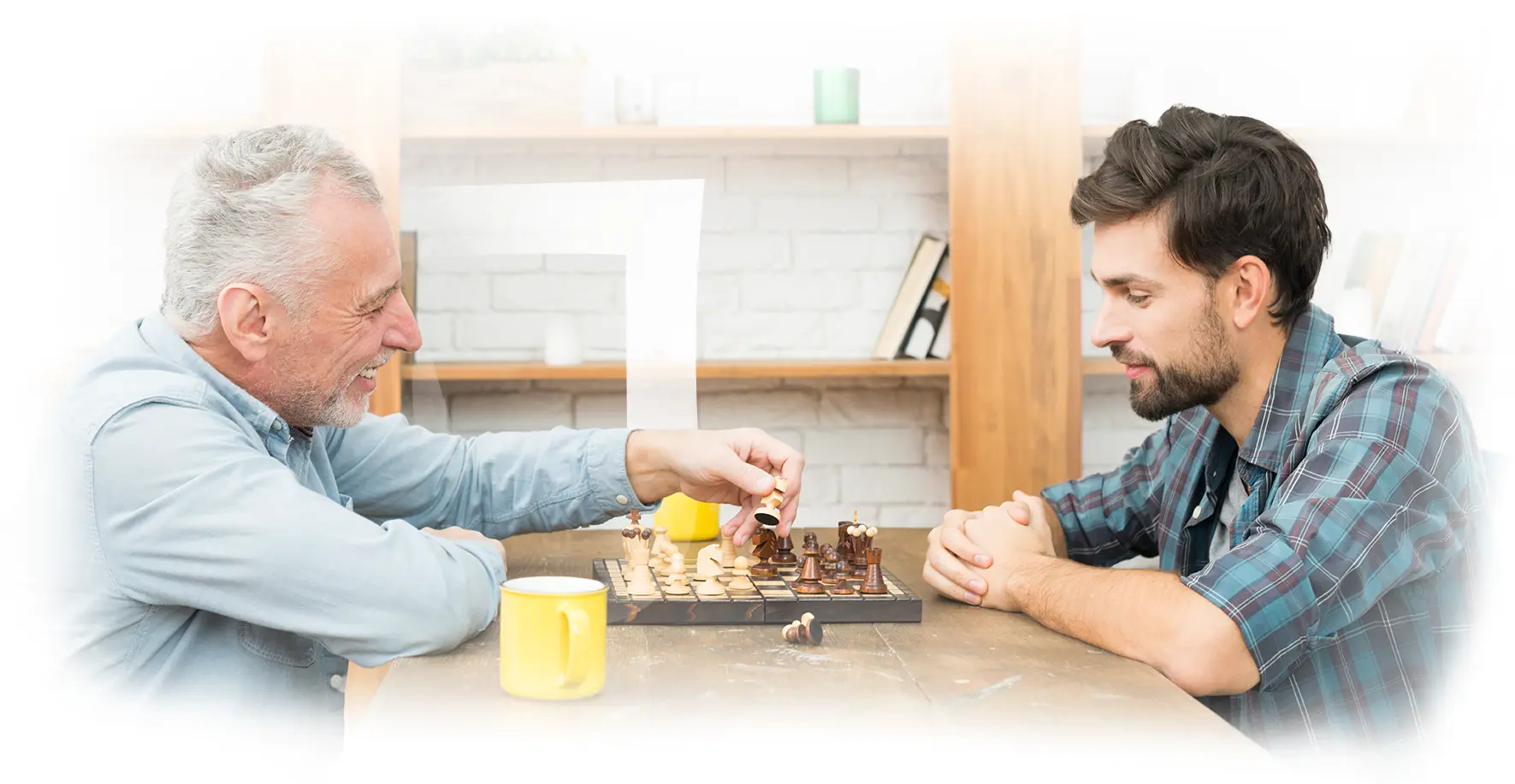 Two people enjoying a chess game indoors.