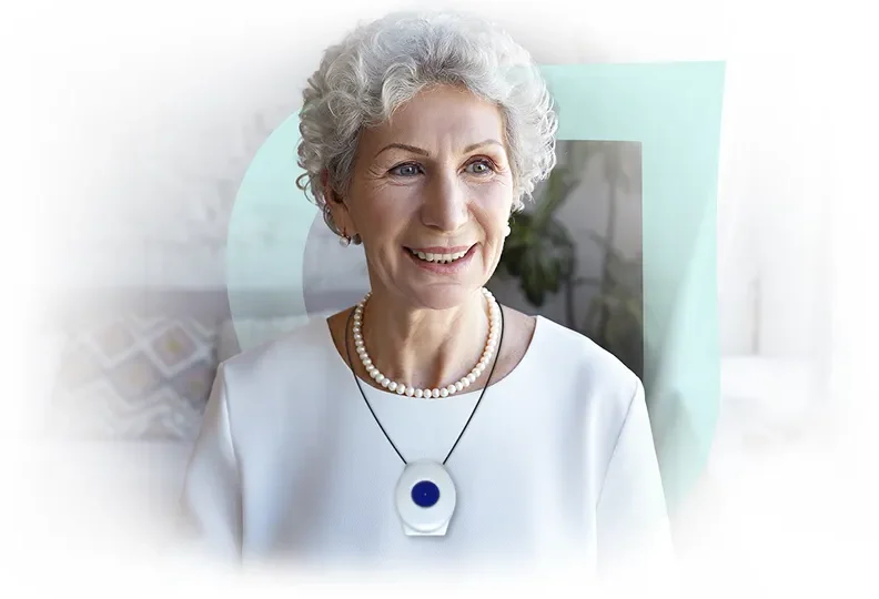 Smiling elderly woman with curly hair and necklace.