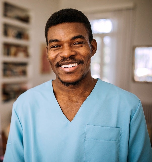 Smiling healthcare worker in scrubs