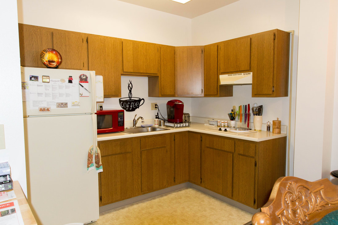 Bright kitchen area with appliances and decor