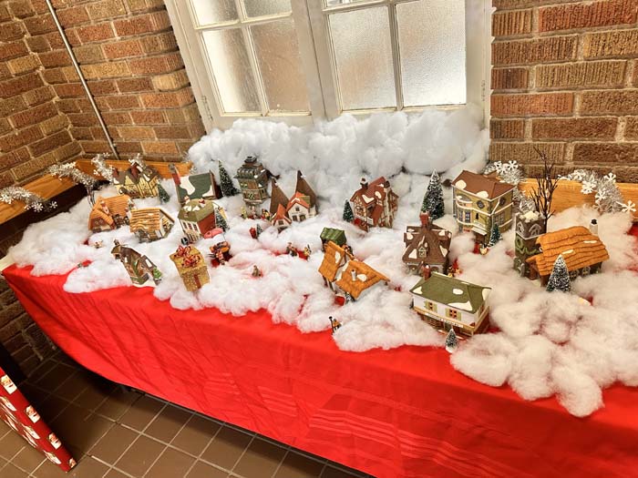Decorative display of a miniature snowy village for festivities