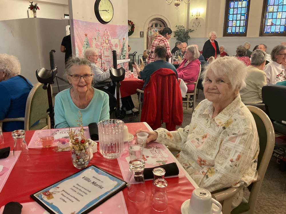 Residents enjoying a festive gathering in a common area
