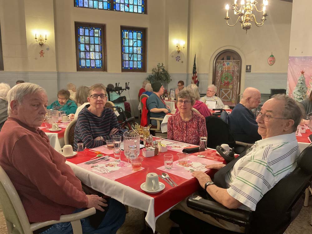 Residents enjoying a meal in the dining room