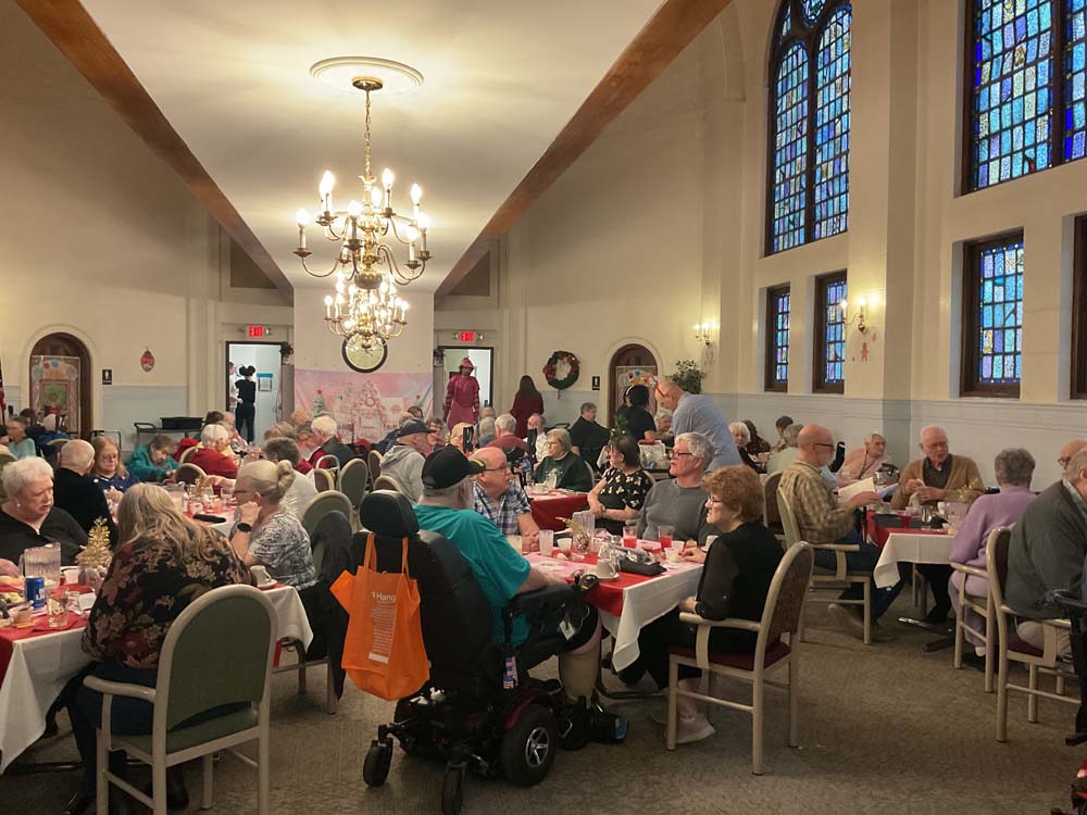 Residents enjoying a festive meal in a dining room