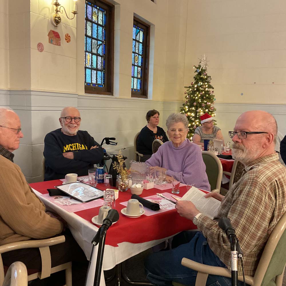Residents enjoying a meal during a festive gathering