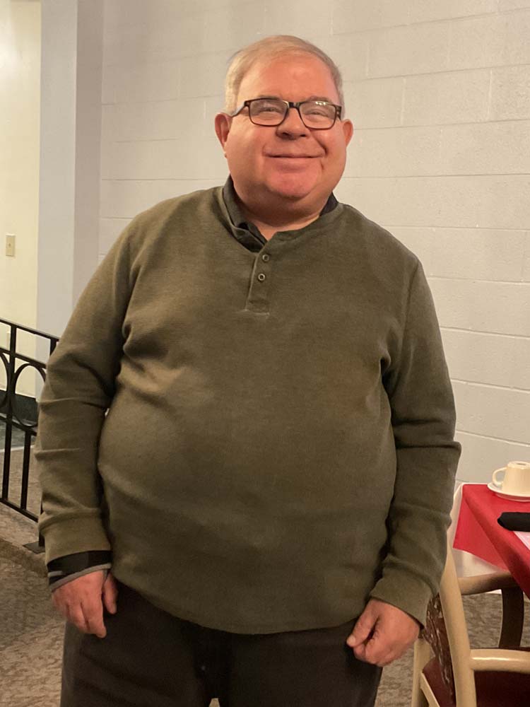 Resident standing in a common area of the facility