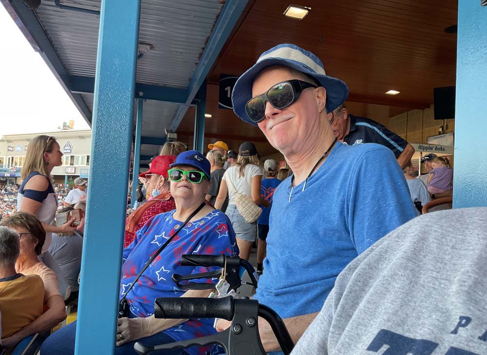 Residents enjoying an outdoor event at a stadium