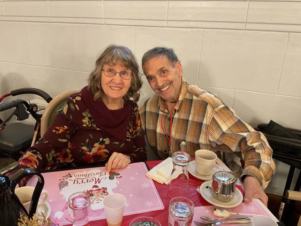 Two residents enjoying a meal together at a table