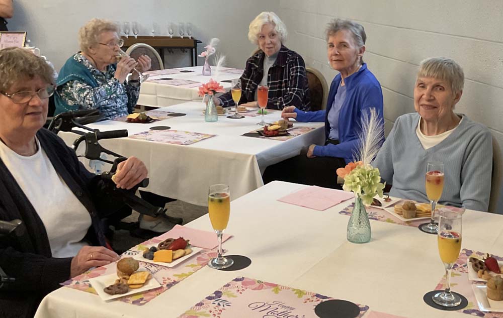 Residents enjoying a meal in the dining room