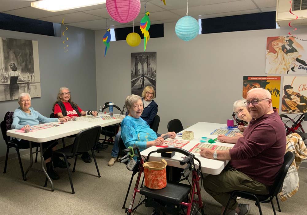 Residents enjoying a bingo game in an activity room