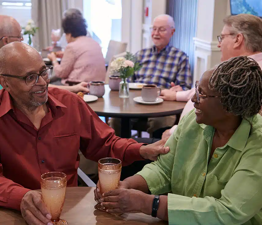 Residents enjoying drinks and conversation in a common area