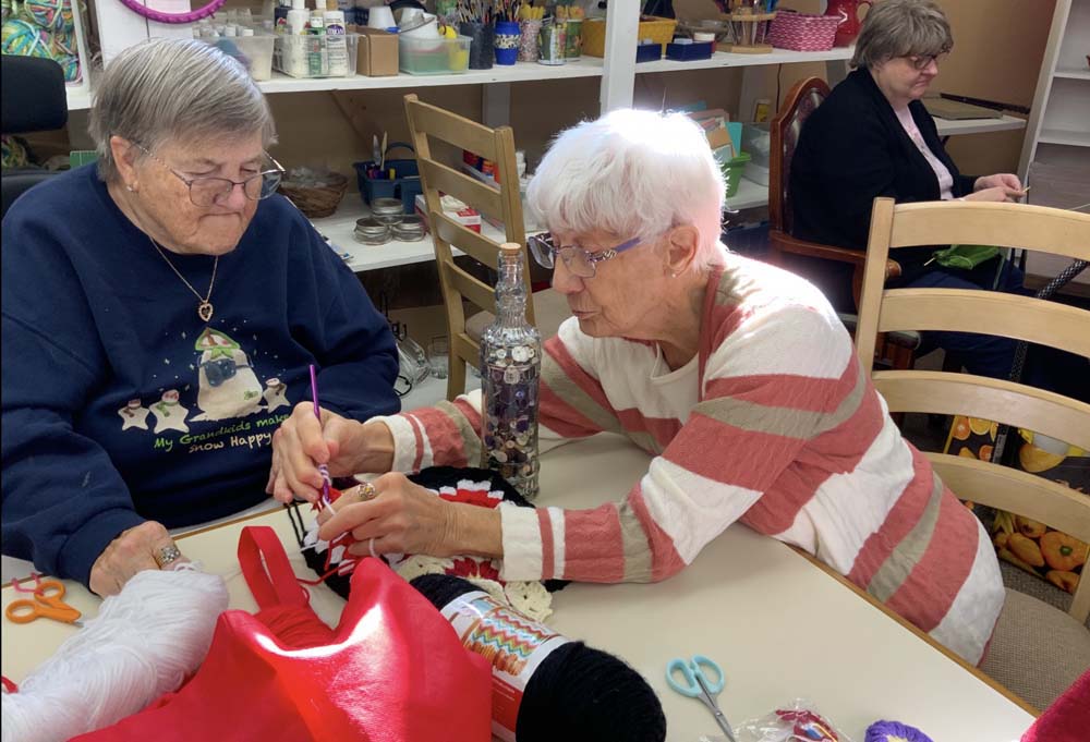 Residents engaged in a crafting activity together