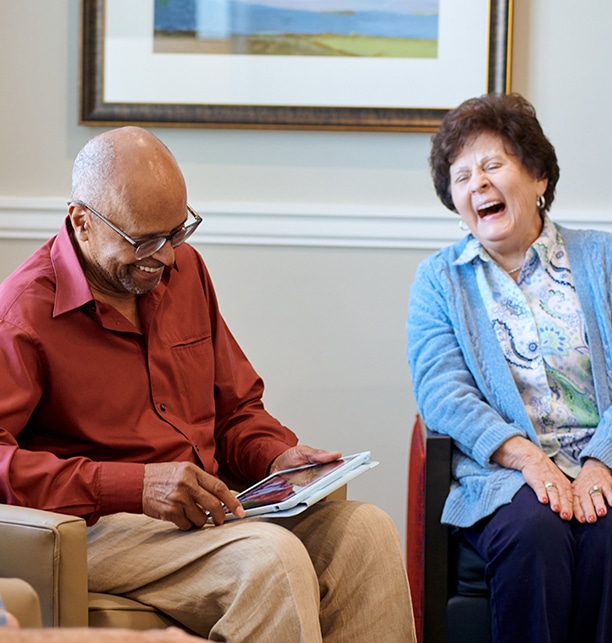Residents sharing a joyful moment in a common area