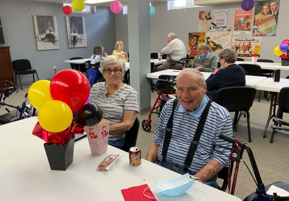 Residents enjoying a festive gathering in a common area