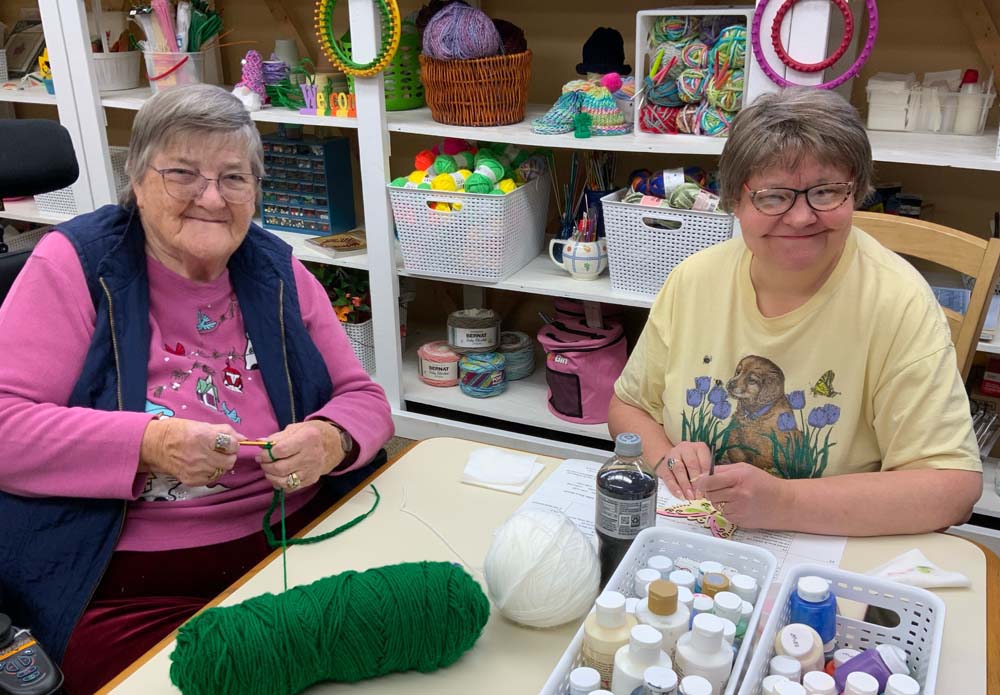 Two residents enjoying a craft activity together