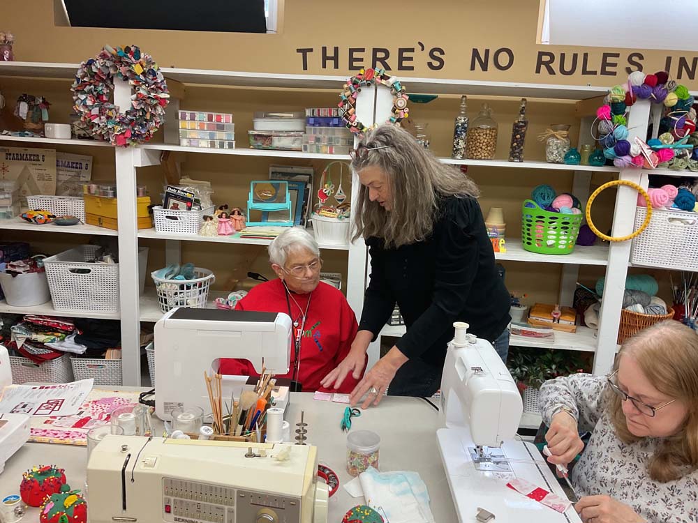 Residents engaging in a sewing activity together