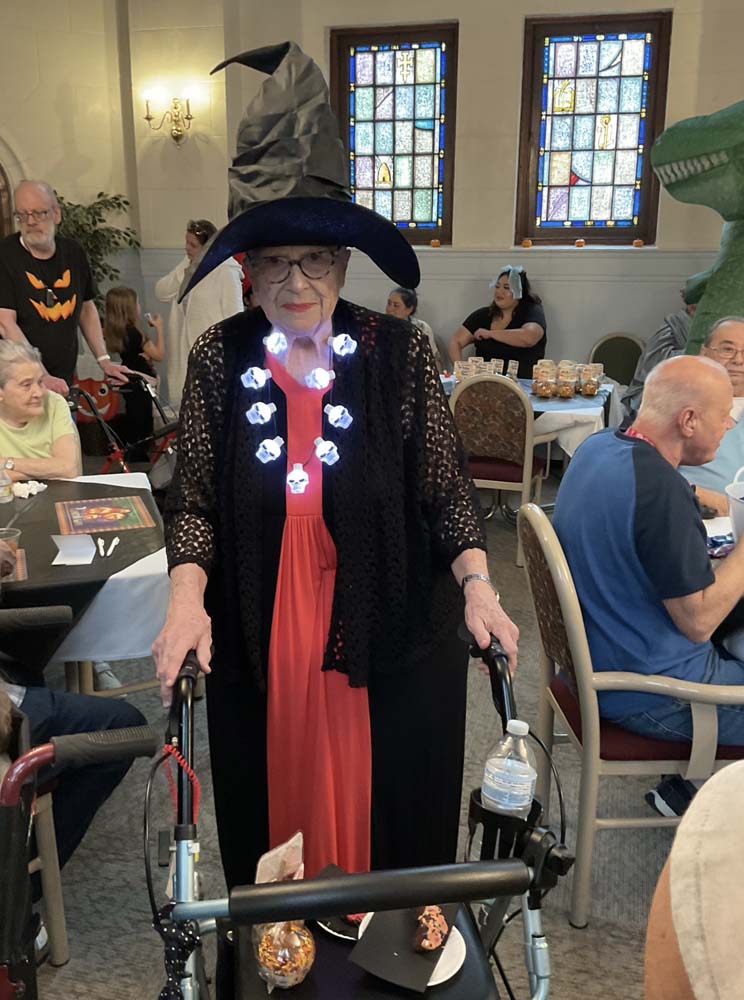 Resident dressed in costume at a community event