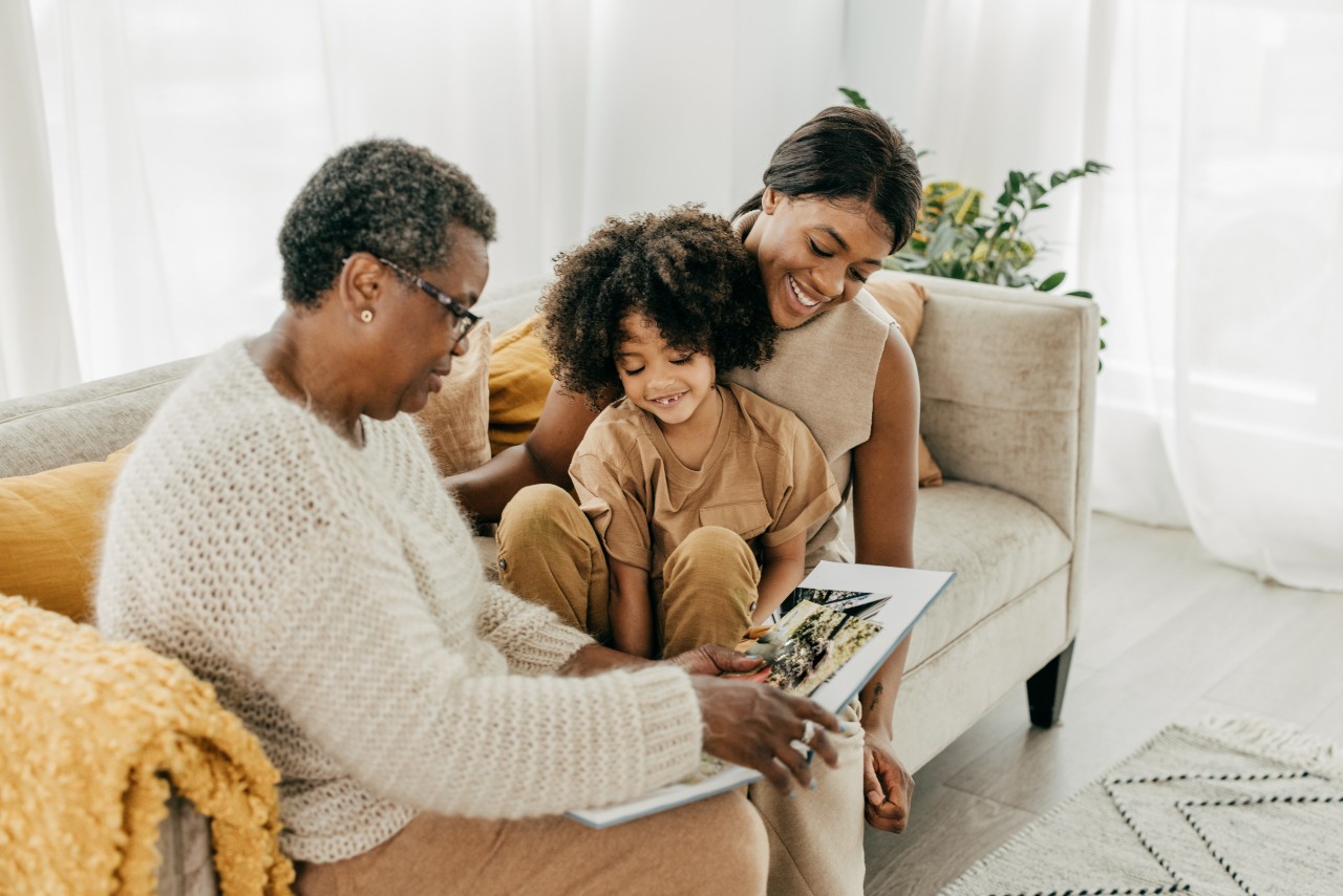A resident enjoying a photo album with family