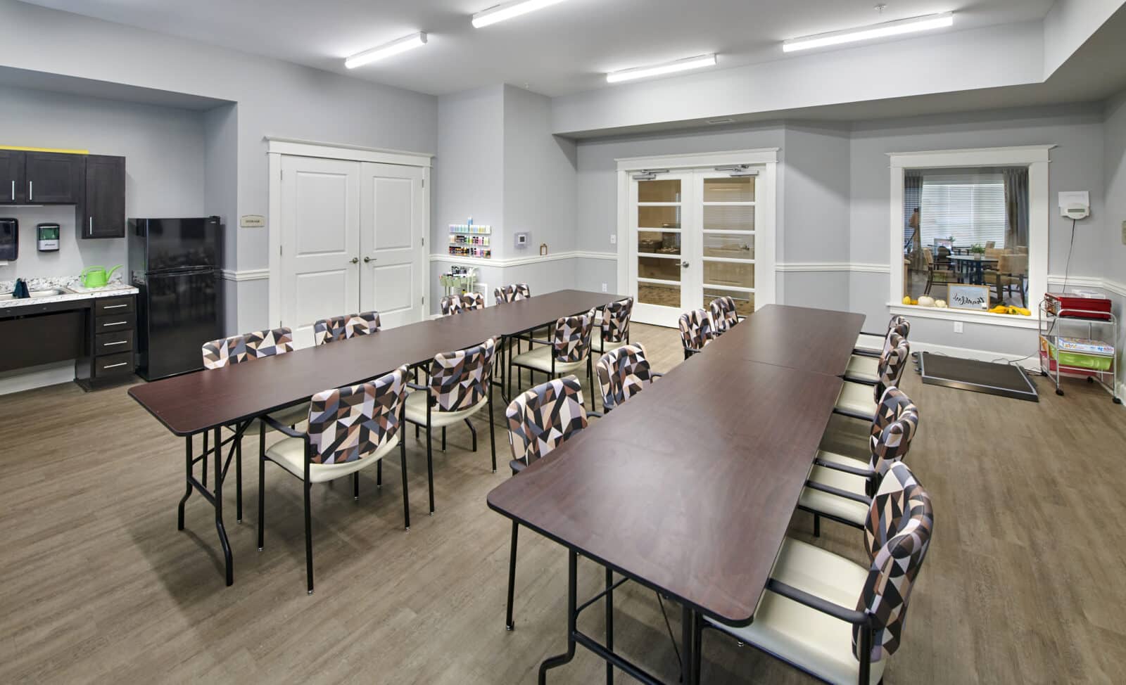 Bright common area with tables and chairs