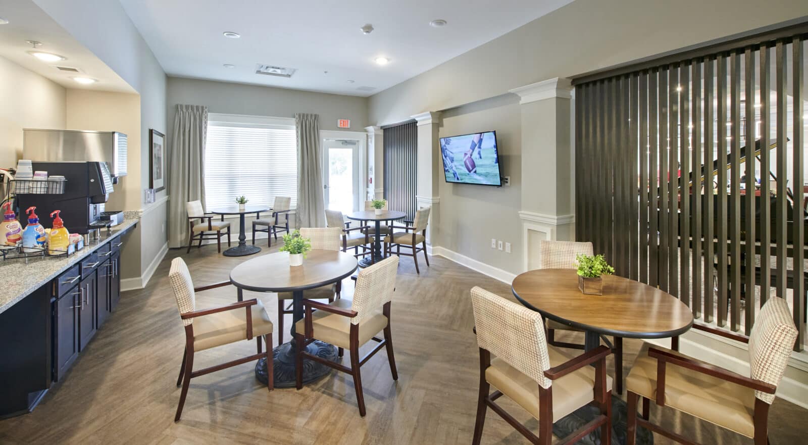Cozy common area with tables and a television