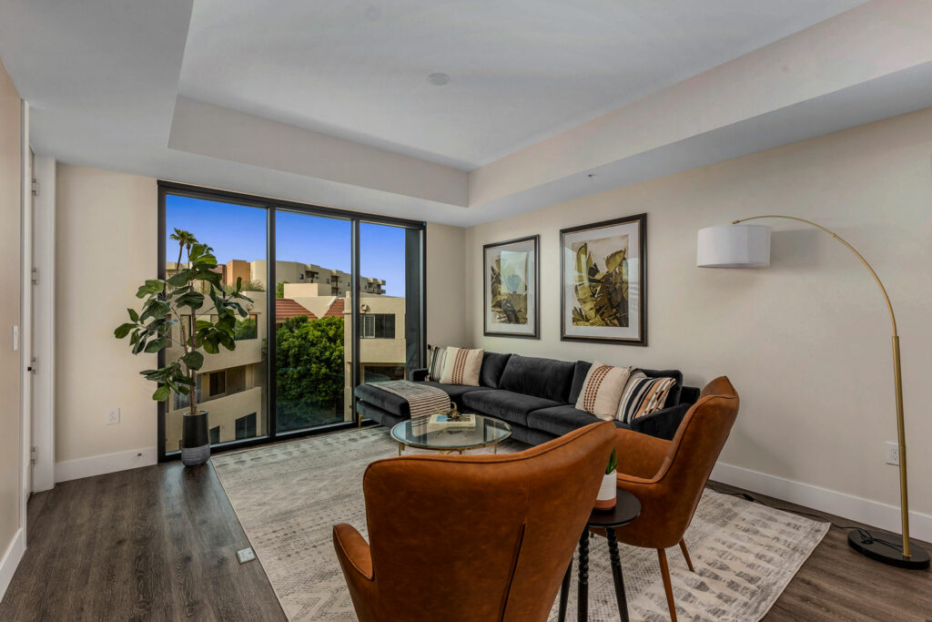 Modern common area with seating and large windows