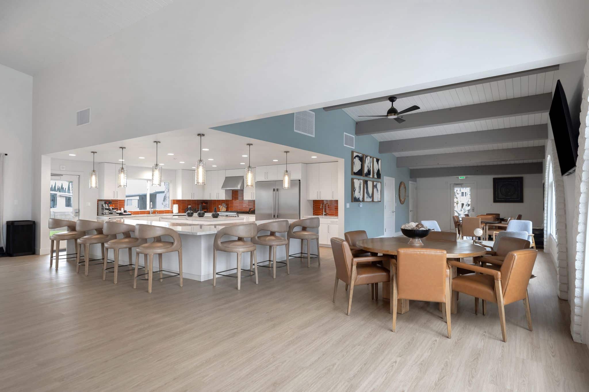 Bright, spacious common area with dining setup