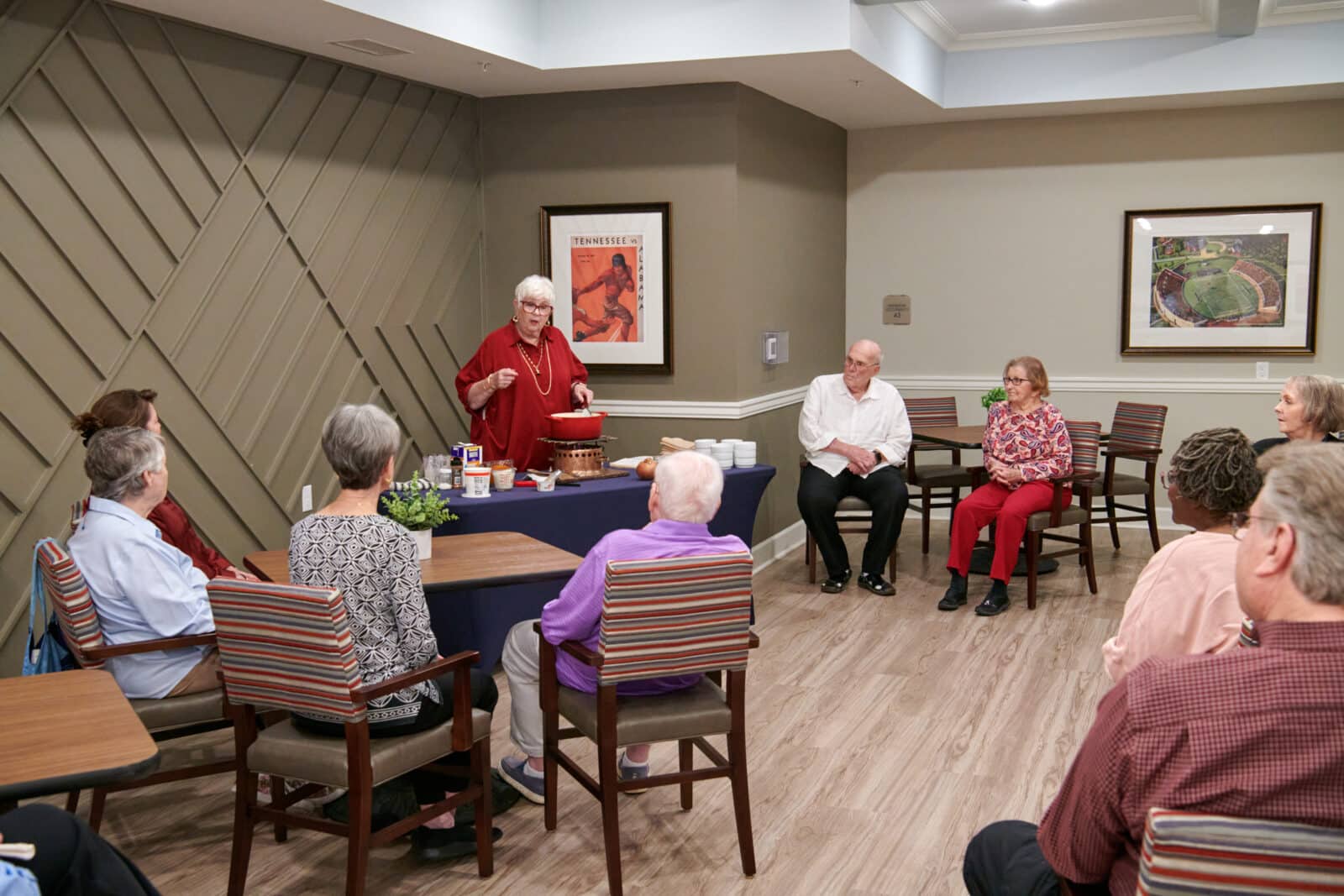 Residents engaged in a cooking activity in a common area