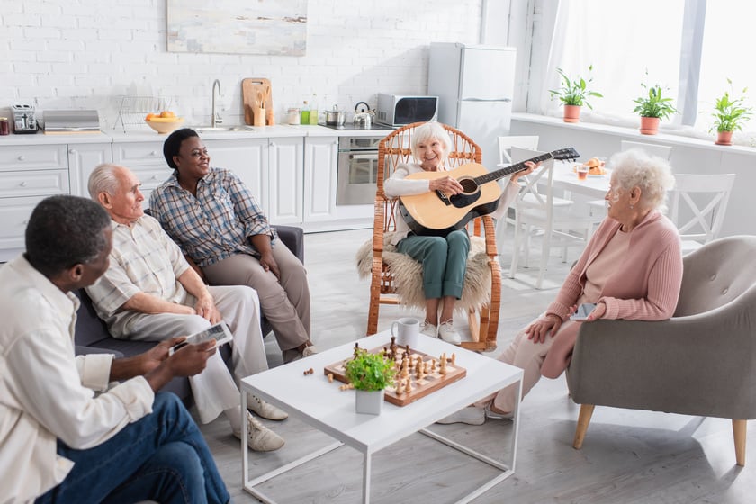 Residents enjoying music in a cozy common area