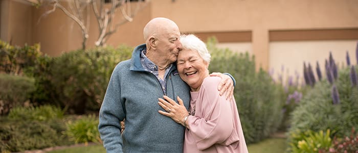 A couple enjoying time outdoors in a garden