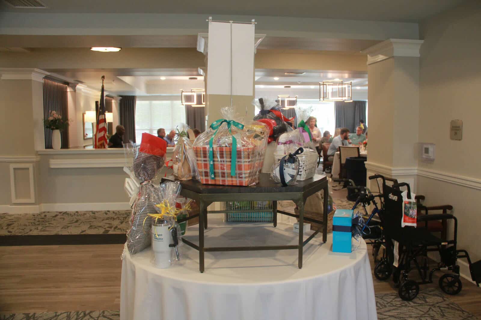 Residents participating in a community event with gift baskets.