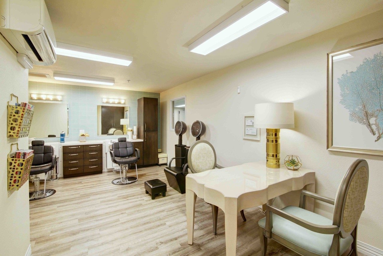 Interior of a salon area with chairs and mirrors