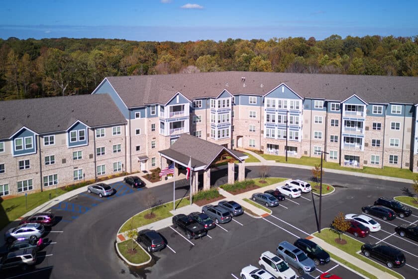 Aerial view of a nursing home facility with parking lot
