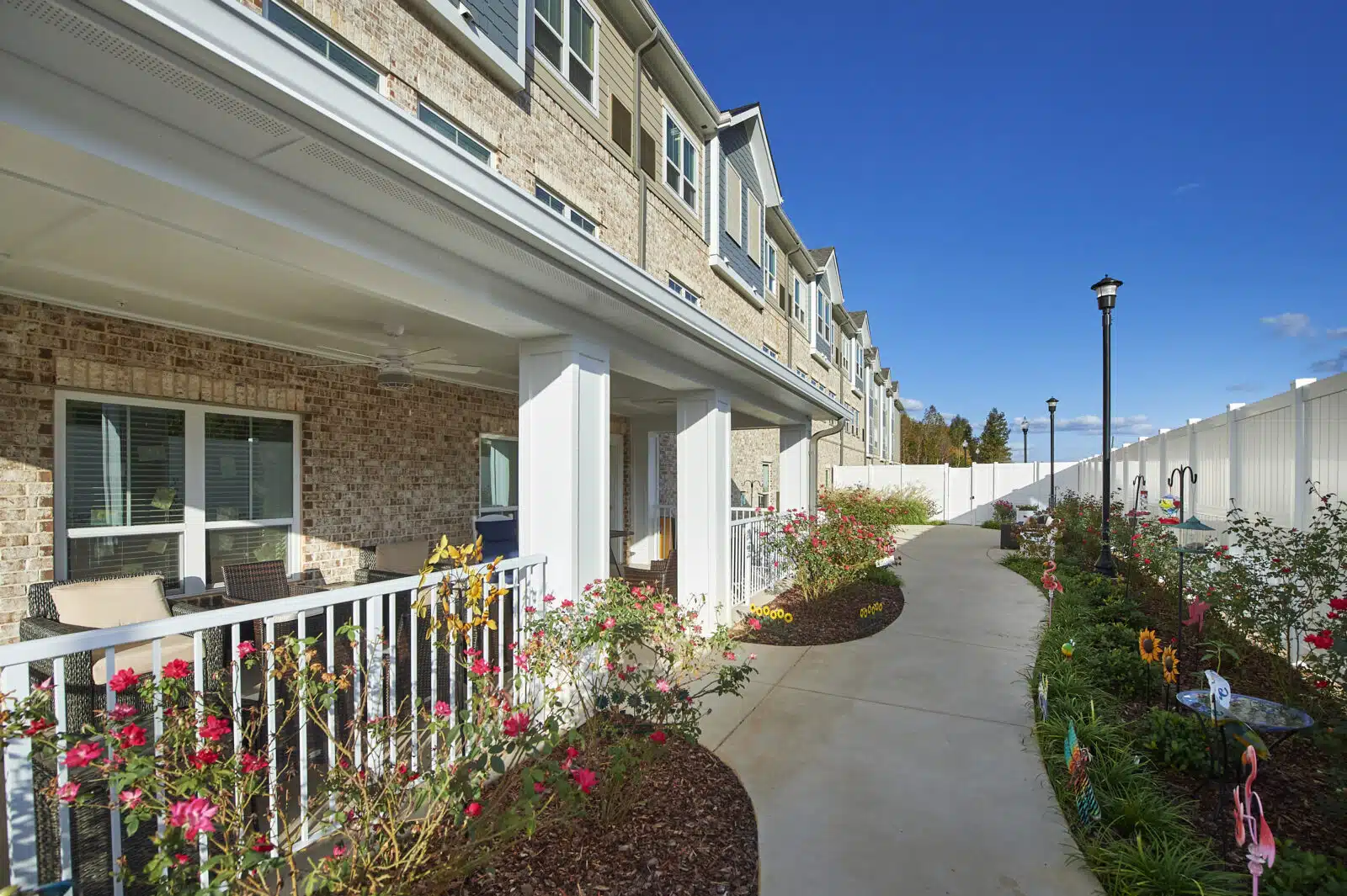 Pathway through landscaped outdoor space at a senior living community