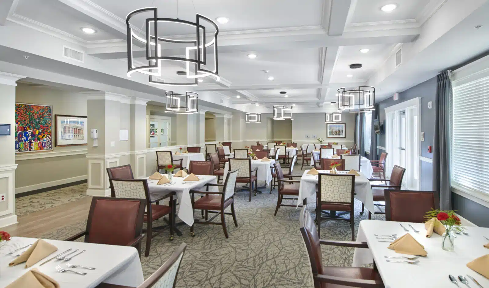 Bright dining room filled with tables and chairs