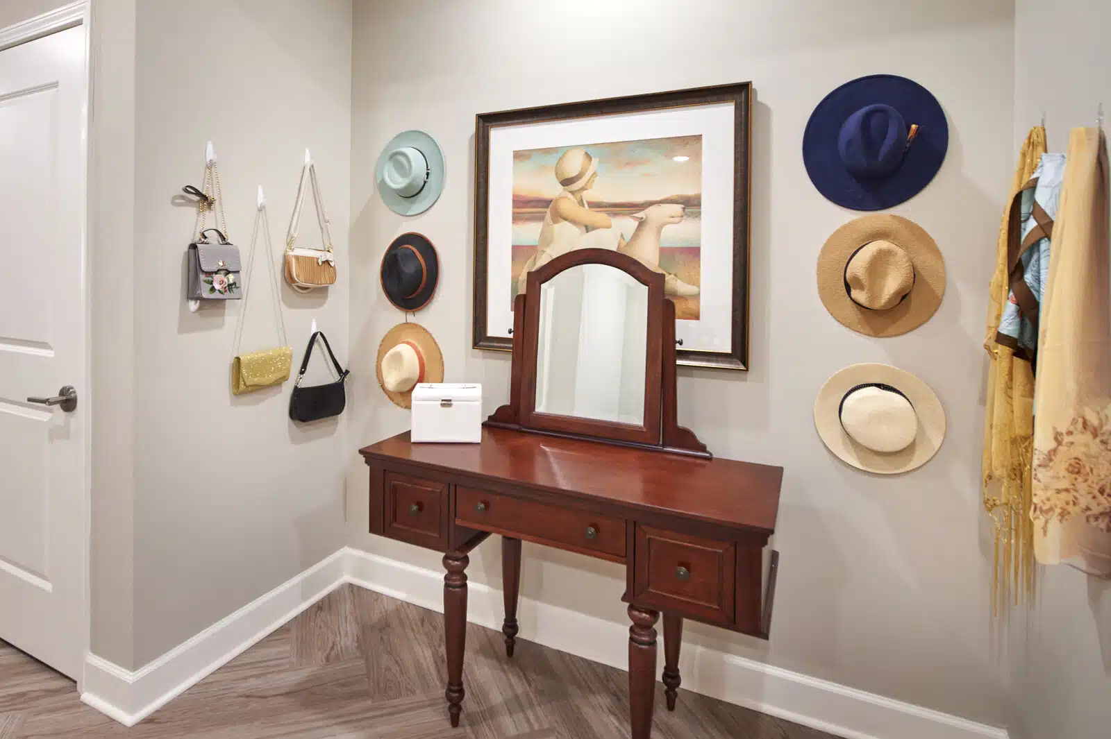 Decorative entryway with hats and wall art