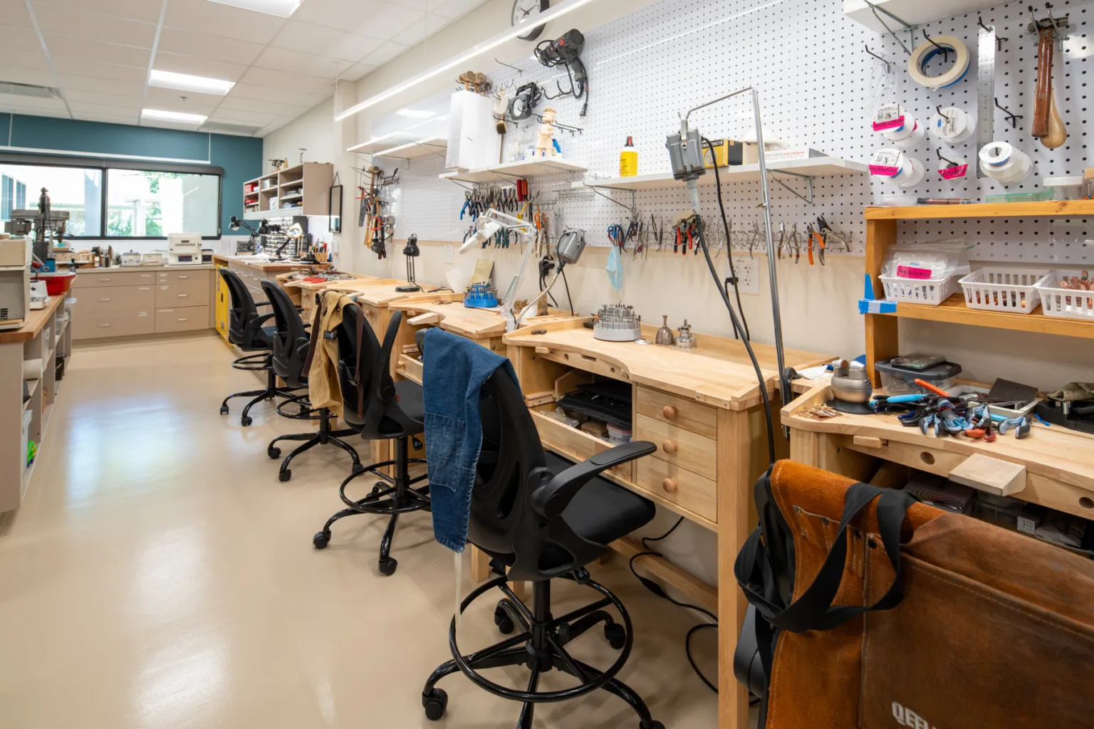 Interior photo of a workshop with wooden workstations
