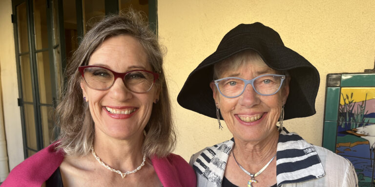 Two women smiling together at Fredericka Manor