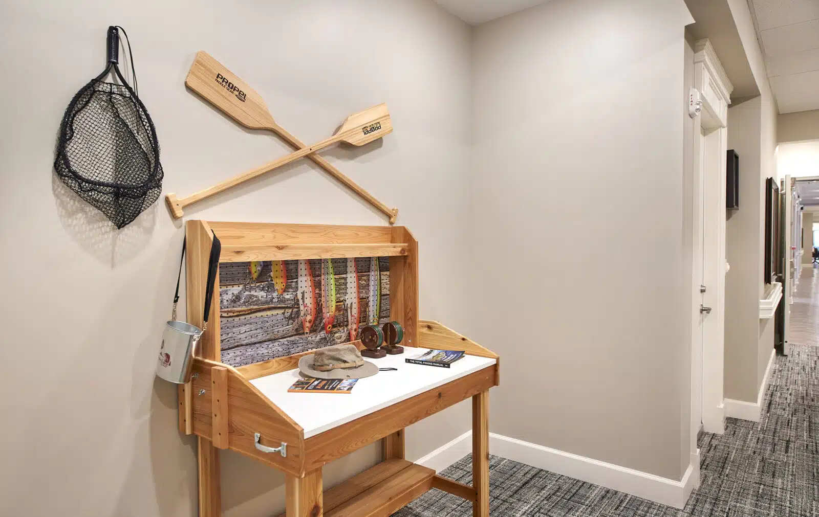 Decorative hallway setup with fishing gear