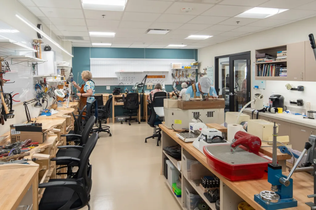 Residents engaged in a craft workshop inside the facility