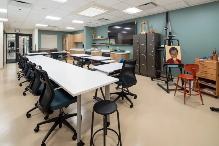 Interior of an activity room with tables and chairs