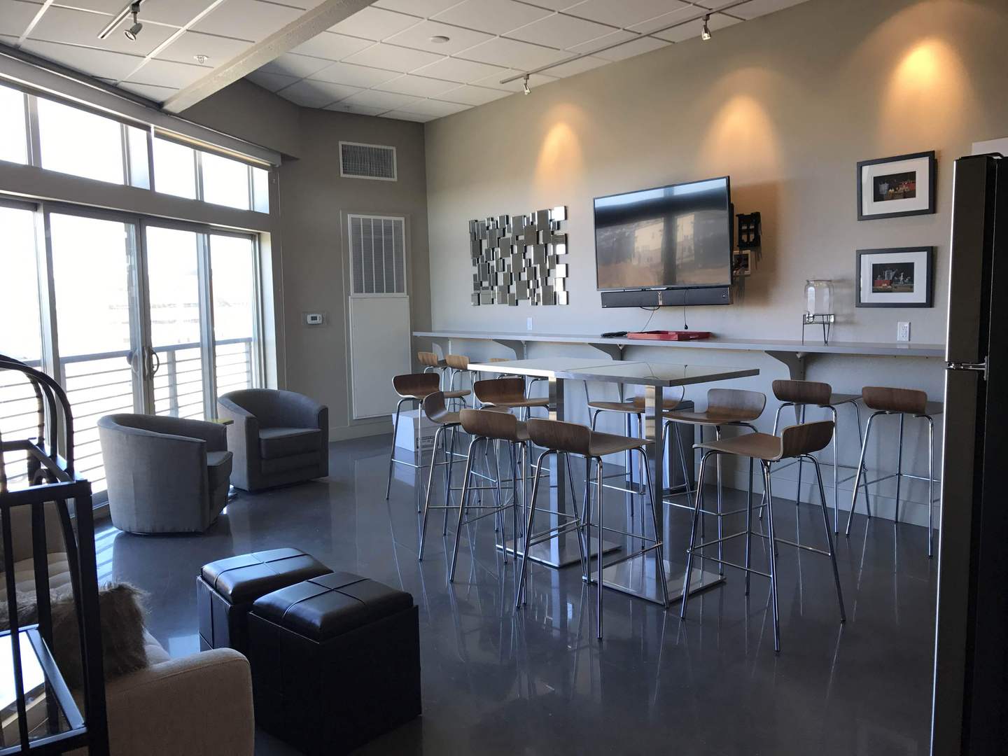 Bright common area with modern seating and bar