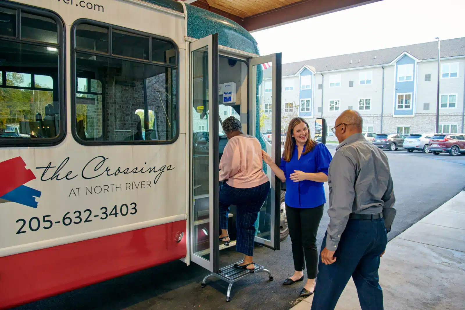 Residents boarding a facility transport vehicle