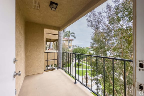 Balcony view overlooking landscaped grounds